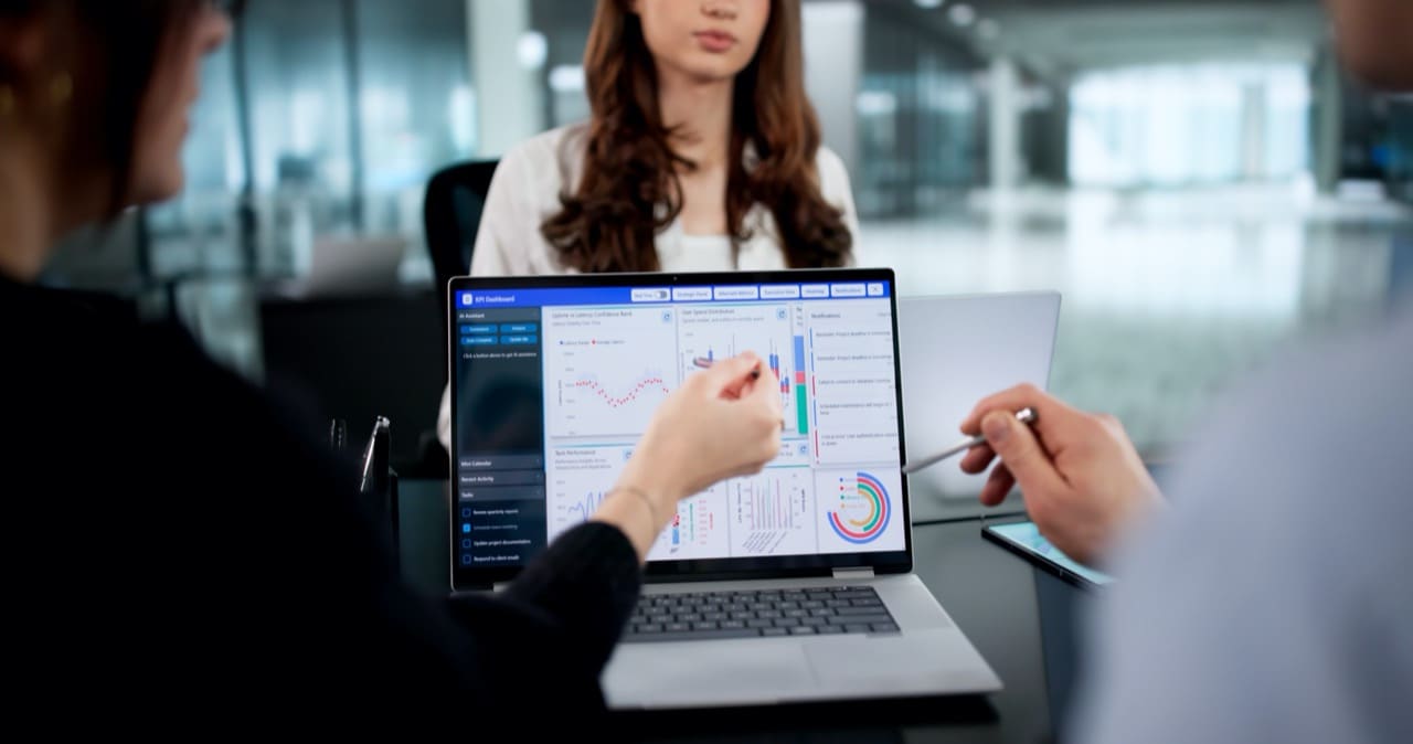 Diverse team using technology for predictive data analytics